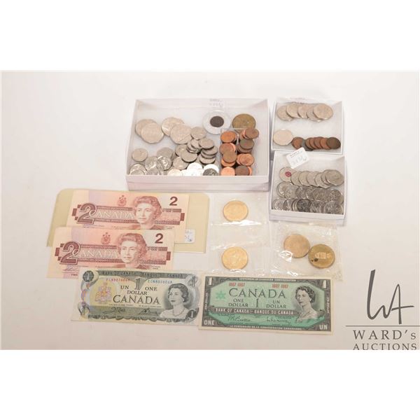 Large selection of Canadian coins including nickels, pennies, special edition quarters, four $1 coin