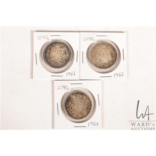 Three Canadian 50 cent coins including 1964, and 1966 X 2