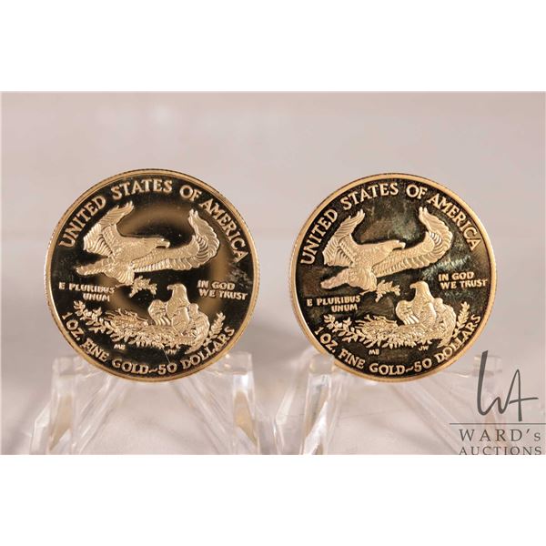 Two gold plated United States of America replica $50 dollar coins, both dated 2016
