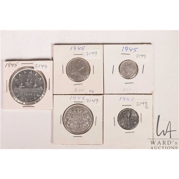 Five Canadian 1945 coins including nickel, dime, quarter, fifty cent and silver dollar
