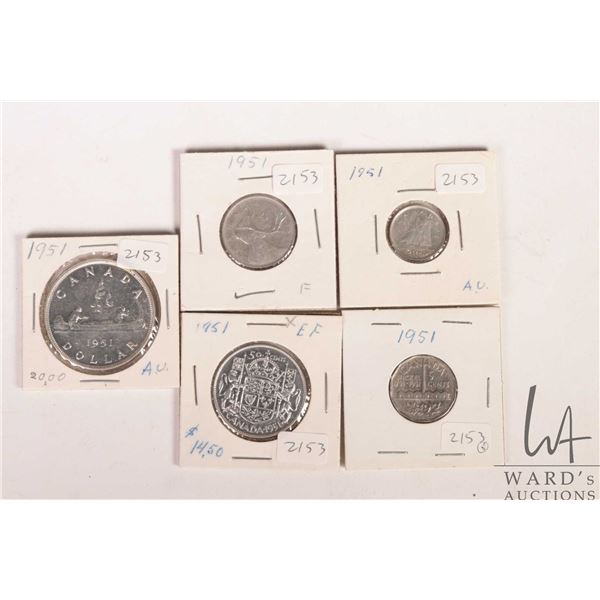 Five Canadian 1951 coins including nickel, dime, quarter, fifty cent and silver dollar
