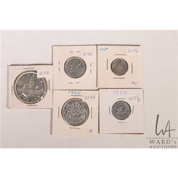Five Canadian 1954 coins including nickel, dime, quarter, fifty cent and silver dollar