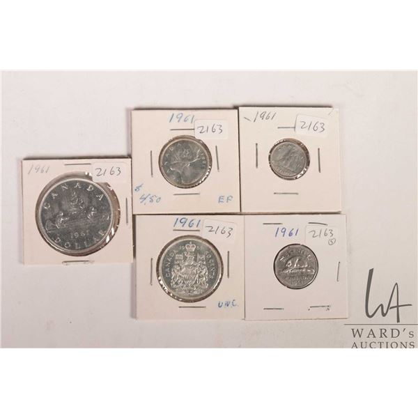 Five Canadian 1961 coins including nickel, dime, quarter, fifty cent and silver dollar