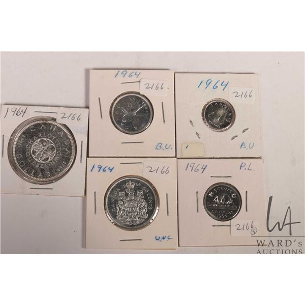 Five Canadian 1964 coins including nickel, dime, quarter, fifty cent and silver dollar