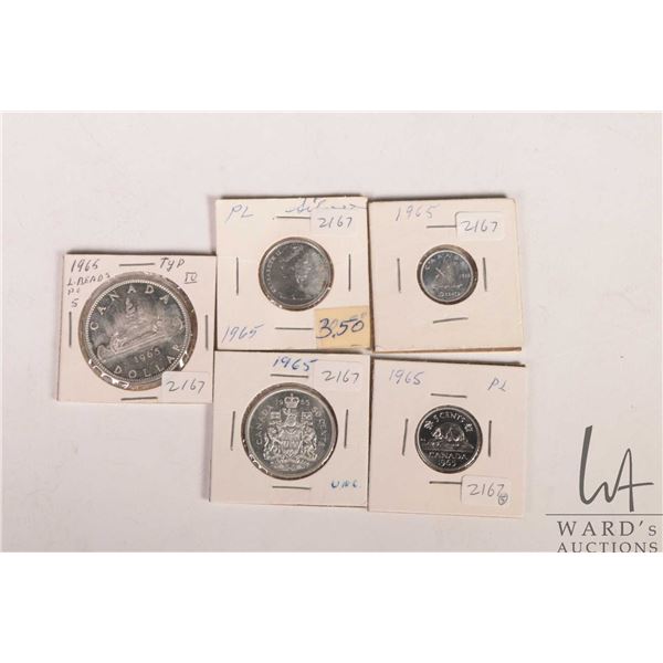 Five Canadian 1965 coins including nickel, dime, quarter, fifty cent and silver dollar