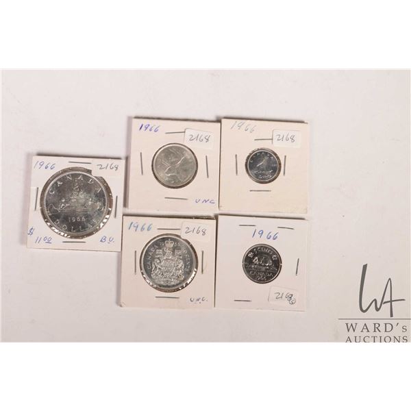 Five Canadian 1966 coins including nickel, dime, quarter, fifty cent and silver dollar