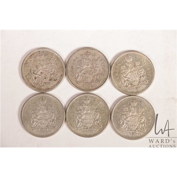 Six Canadian fifty cent coins including 1960, 1961, 1963, 1964, 1964 and 1965