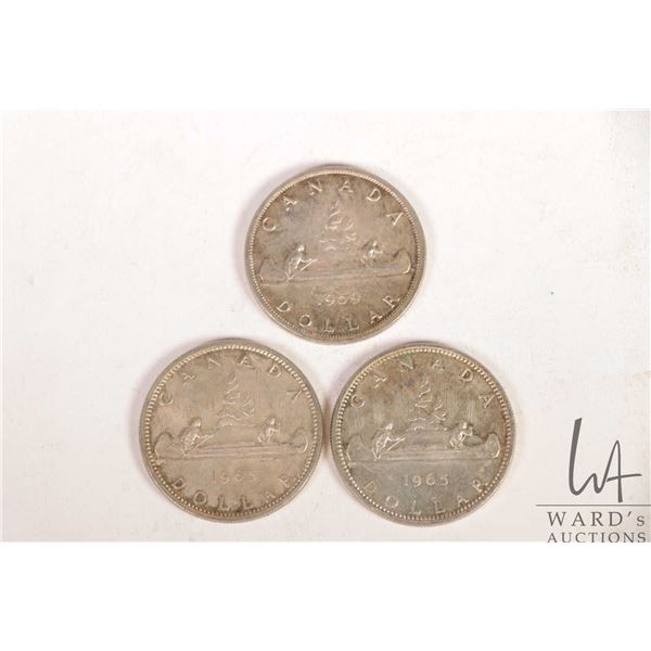 Three Canadian silver dollars including 1959 and 1965 X 2