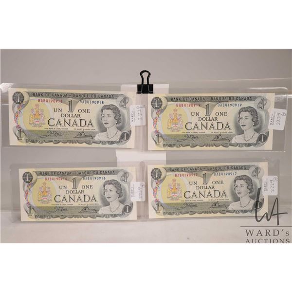 Four 1973 Canadian $1 bills with consecutive serial numbers