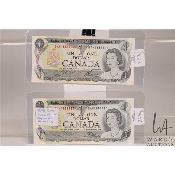 Two 1973 Canadian $1 bank notes with consecutive serial numbers