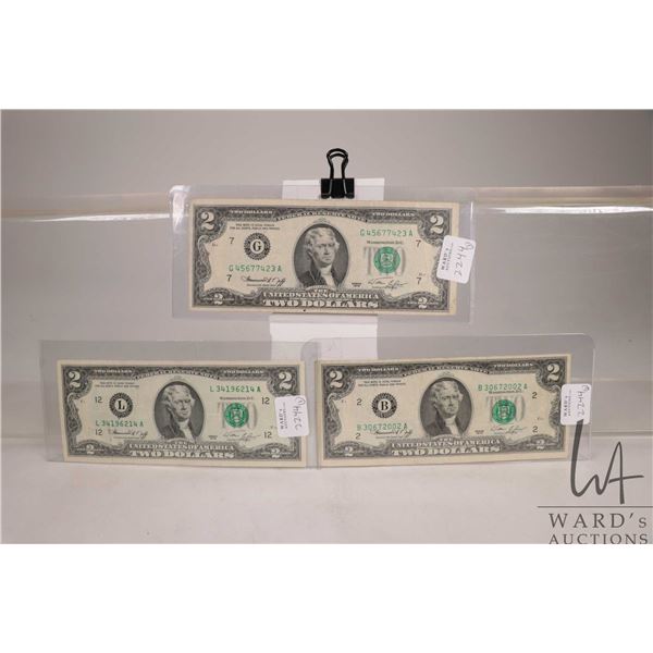 Three 1976 green seal American $2 bills