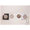 Image 1 : Four Canadian fifty cent coins including 1944, 1947, 1950 and 1951