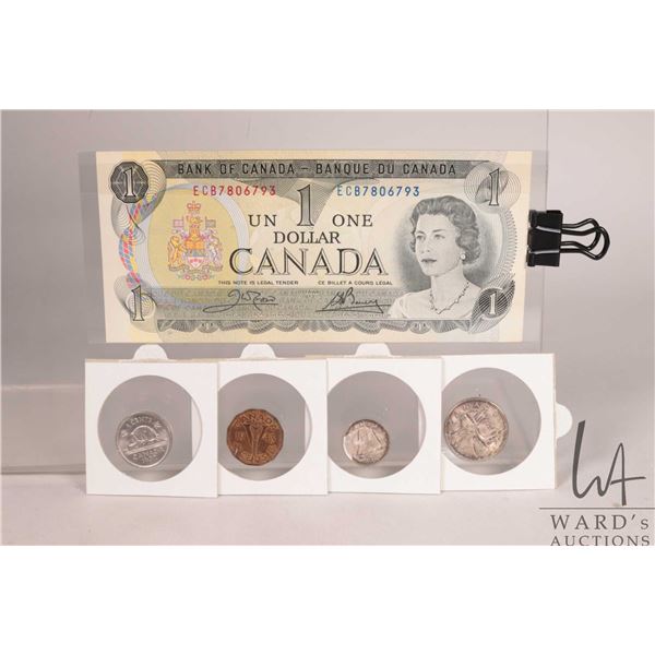 Four Canadian coins and a 1973 one dollar bill