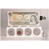 Image 1 : Four Canadian coins and a 1973 one dollar bill