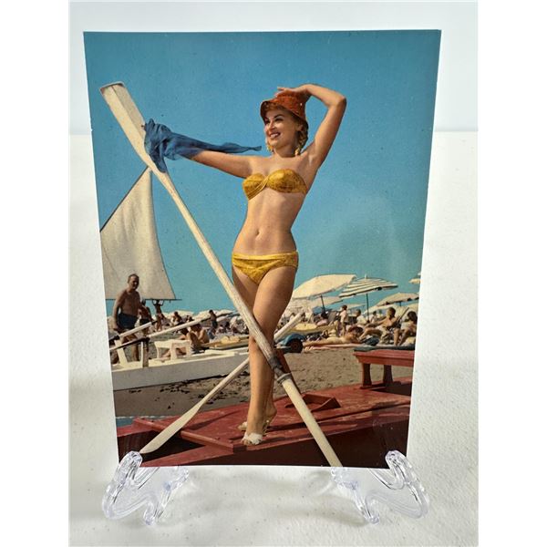 Vintage 1960s Postcard   Woman in Yellow Bikini with Oar on Beach