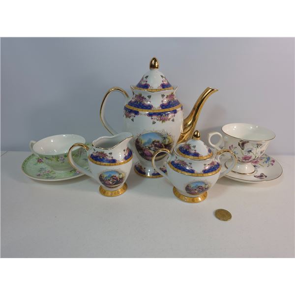 Ornate Gold-Trimmed Teapot Set with Teacups