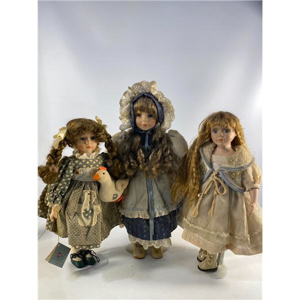 Trio of Porcelain Dolls with Accessories