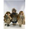 Image 1 : Trio of Porcelain Dolls with Accessories