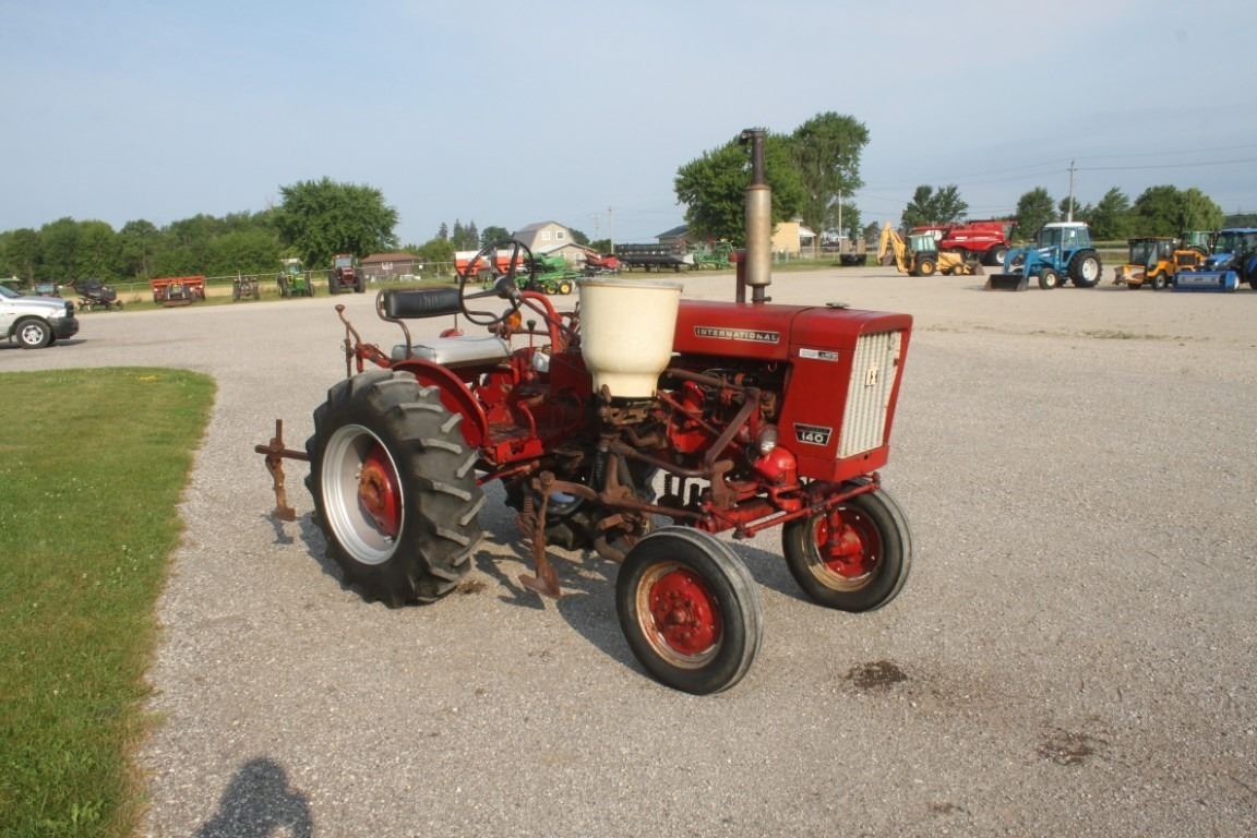 IH 140 2wd tractor, mounted cultivator, side dresser