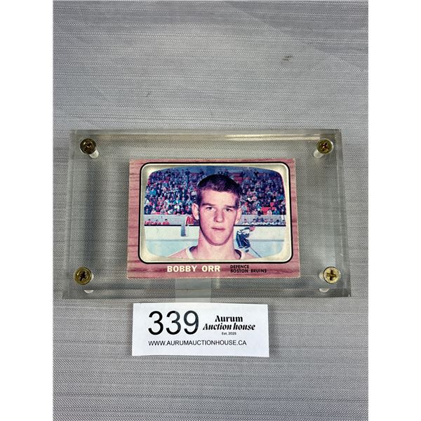 Auctioneer Believes it to be a Copy a Bobby Orr Rookie Card in Museum Case