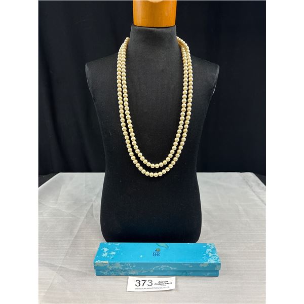 A Huge 48" Strand of Vintage Faux Pearls