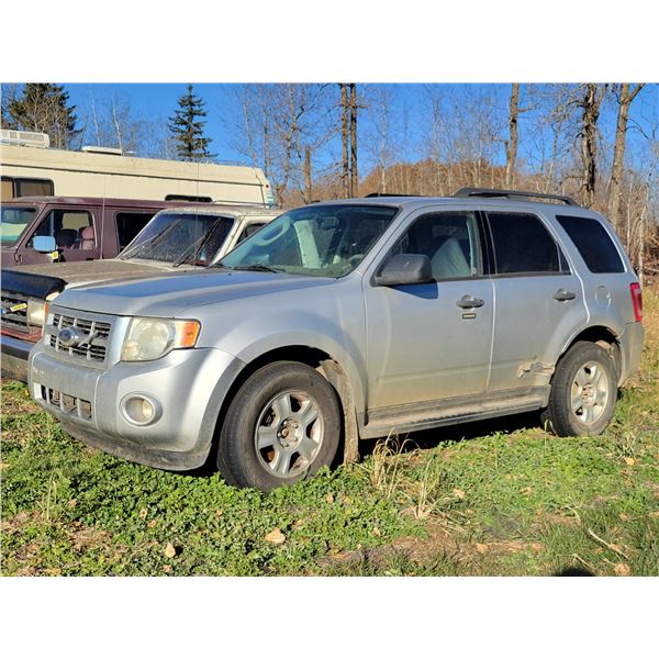 2009 Ford Escape, V6 auto, 243,464 km, is running. Needs windshield, tires & brakes, SN. 1FMCU93G69K