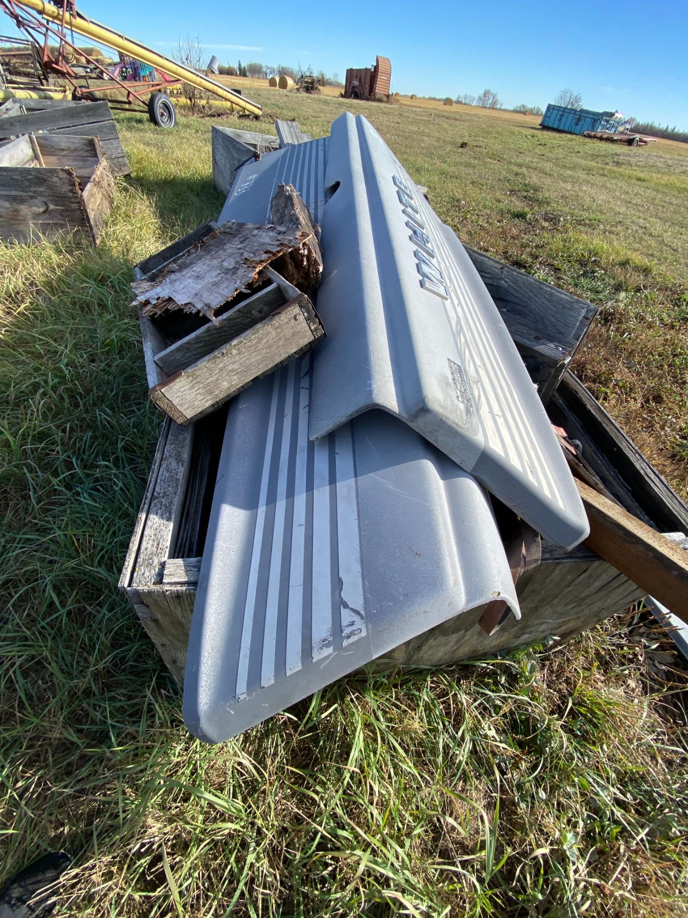 Crate Full of White Tractor Shields & Misc.,