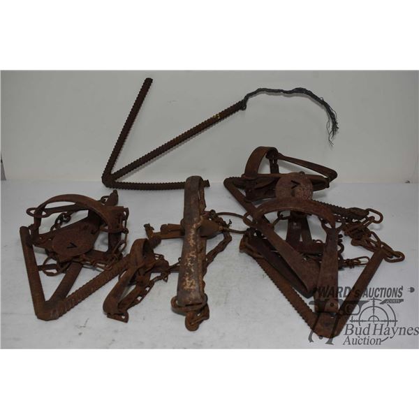 Three Onieida-Victor #3 long spring traps w/ chains and anchors, one Bridger #1 long spring trap w/ 