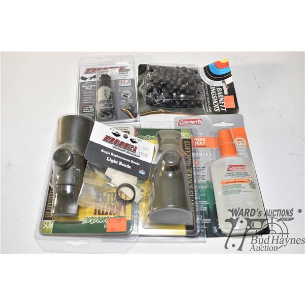 Three game calls and a bag repellent