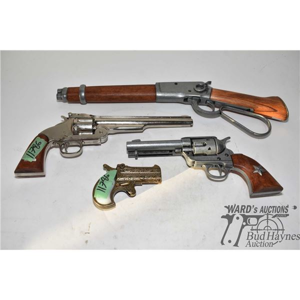 Four display firearms including three pistols and one rifle