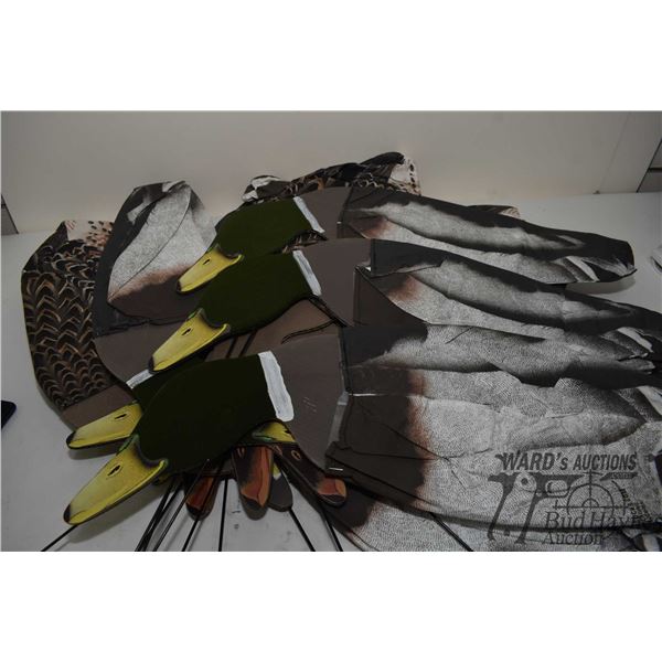13 Wind activated duck decoys in assorted colors, plus 2 wall blinds (1 winter and 1 fall)