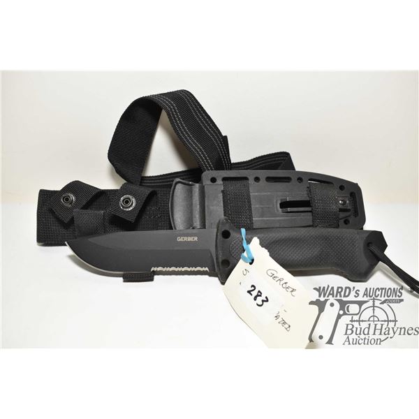 Gerber Army Forces survival knife w/ 5" black serrated edge blade, hard plastic and webbed sheath an