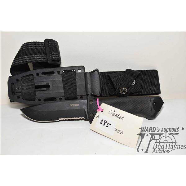 Gerber Army Forces survival knife w/ 5" black serrated edge blade, hard plastic and webbed sheath an