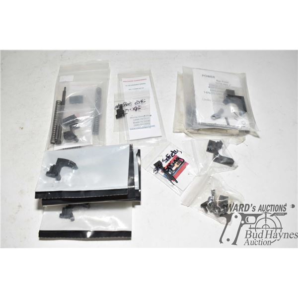 Selection of SKS parts including two competition extended mag releases, two extended mag catches, 3 