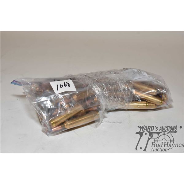Bag w/ 52 rounds of 26 Nosler reloads and 10 brass