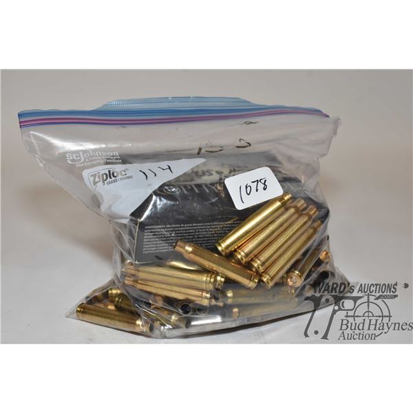 One full 20 count box of .300 win mag reloads and 114 primed brass