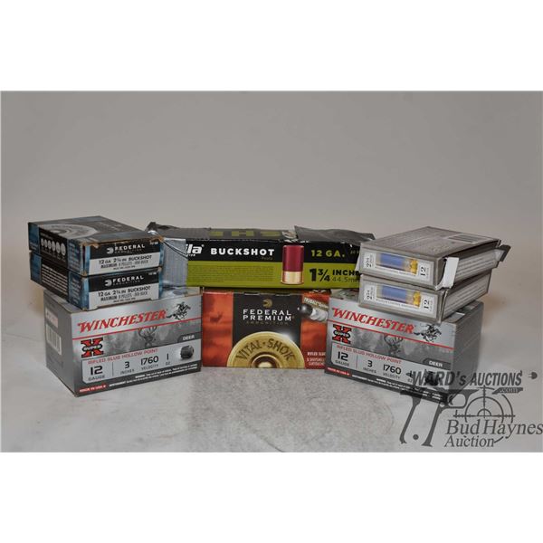Selection of 12 GA ammo including two full 15 count boxes of Winchester 3" deer slugs, two full 5 co