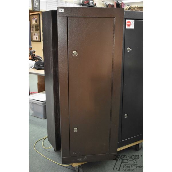 Metal eight gun locker w/ duel locks measuring 55" H x 21" W x 10" D
