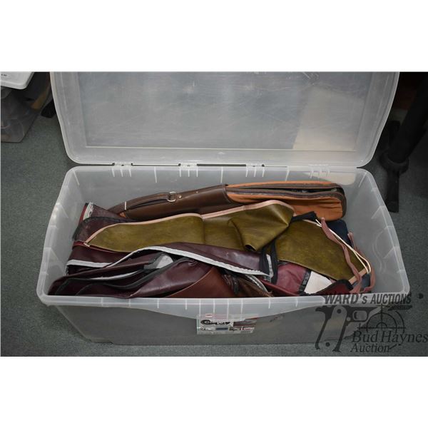 Large plastic tub w/ approx. 25 soft gun cases and socks