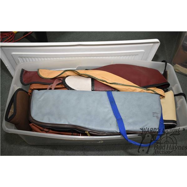 Large plastic tub w/ approx. 25 soft gun cases and socks