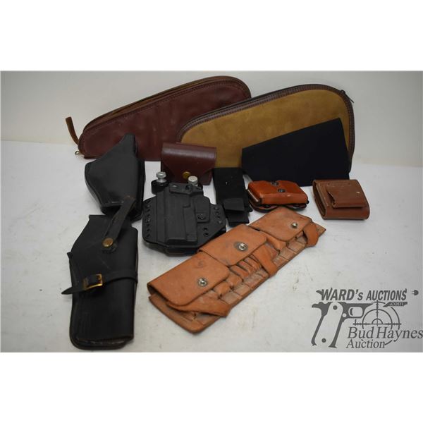 Two soft pistol cases, four leather ammp pouches, two leather holsters and one hard plastic holster