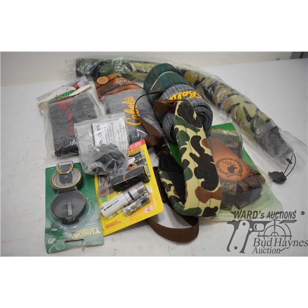 Tray of gun misc. including suspenders, compass moose call, safety light, trigger lock and four gun 