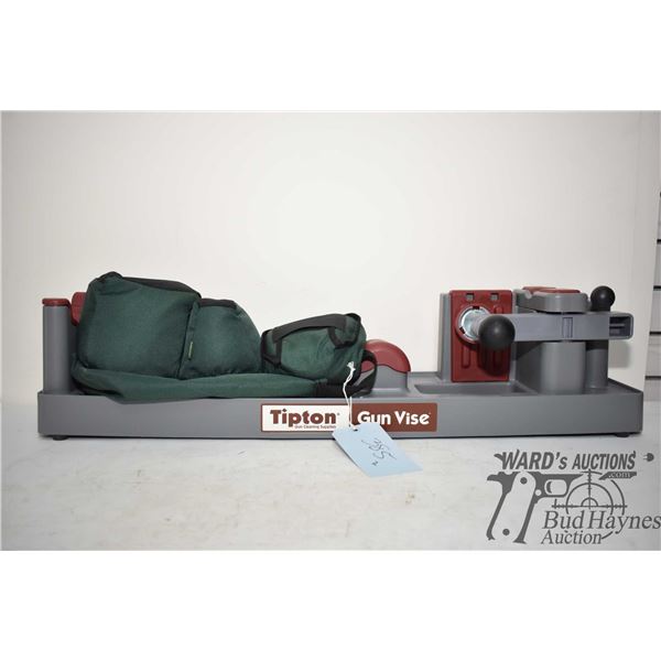 Bag w/ three shooting rest weights and a tipton gun vise