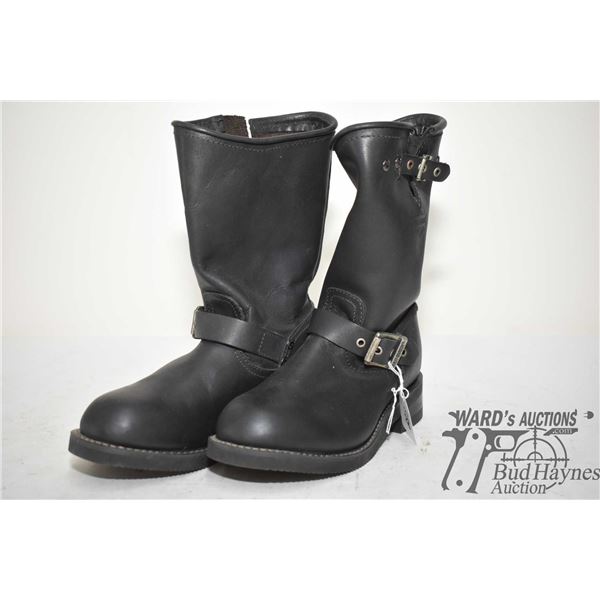 A pair of womens size 7 high top leather Harley Davidson boots