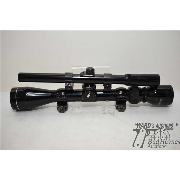 Two rifle scopes including Tasco 3-9x40 w/ rings and a Tasco 4x15 w/ rings