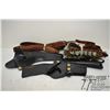 Image 1 : Three assorted black leather holsters, two 12 GA ammo belts and three leather gun slings