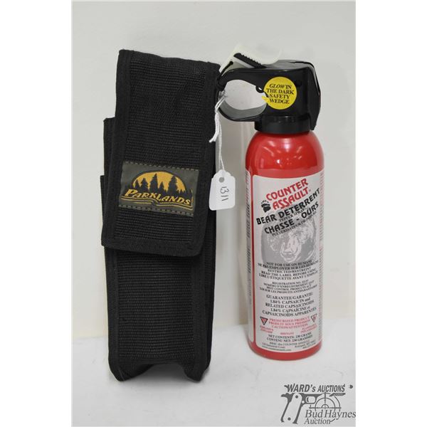 230 gr tin of Counter Assault Bear Deterrent and webbed case