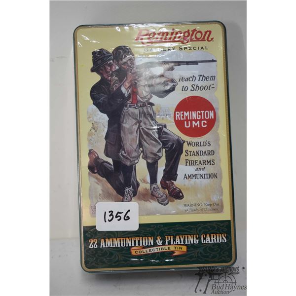 One sealed collectors box Remington ammo w/ 400 count .22 LR gold colored bullets and a deck of play