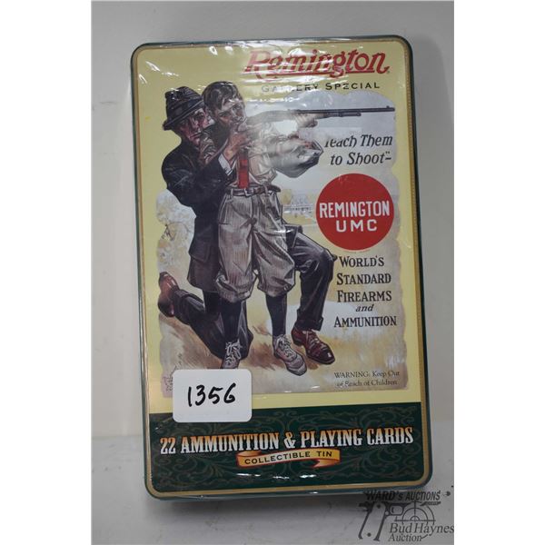 One sealed collectors box Remington ammo w/ 400 count .22 LR gold colored bullets and a deck of play