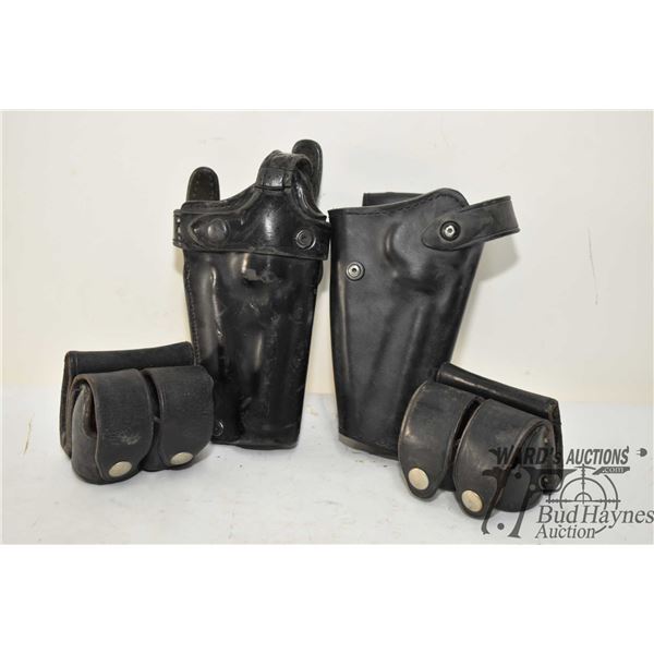Two S&W revolver holsters w/ speed loader pouches